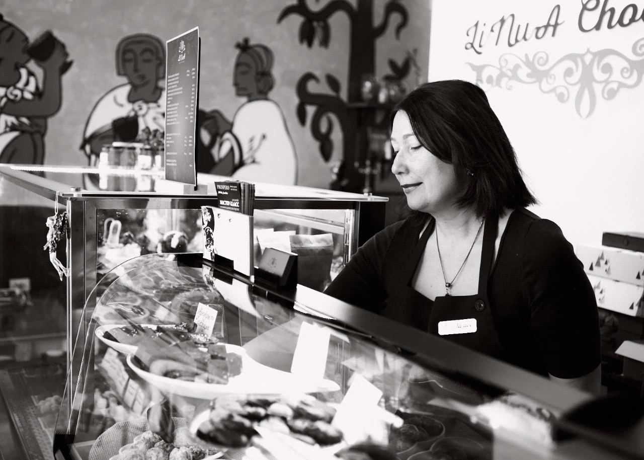 Liliya Shakhatova serving artisan chocolate in her workshop